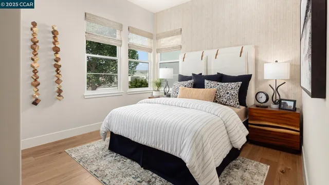 a bedroom with a large bed and a window