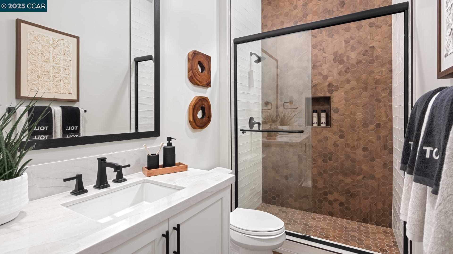 1893 Cascade Lane Tracy, CA 95377 - Photo 9 of 38 a bathroom with a granite countertop sink toilet and shower