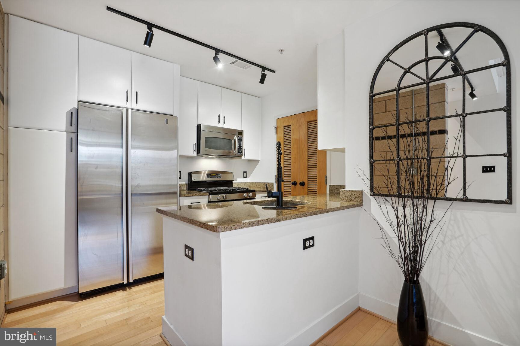 1529 14th Street Northwest, Unit 310 Washington, DC 20005 - Photo 4 of 26 Stainless steel appliances, granite countertops.