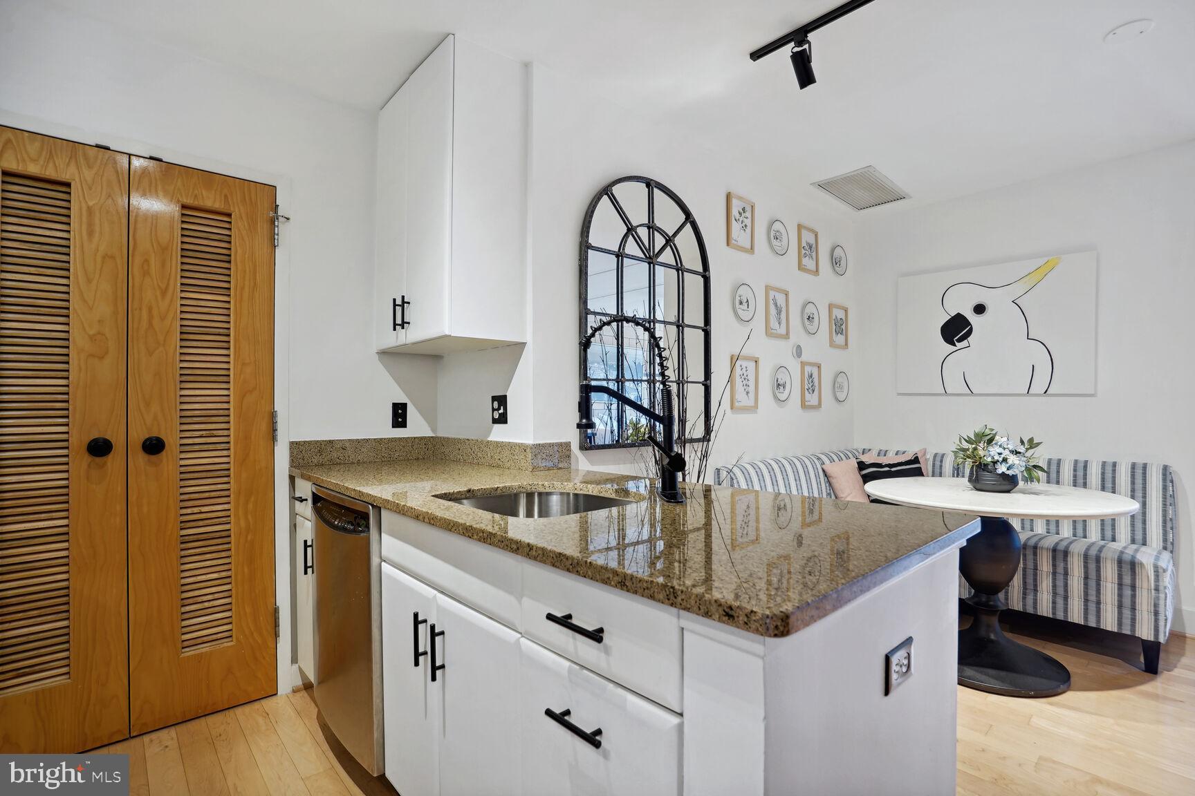 1529 14th Street Northwest, Unit 310 Washington, DC 20005 - Photo 6 of 26 Stainless steel appliances, granite countertops.