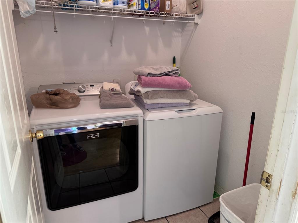 119 Hawthorne Road Auburndale, FL 33823 - Photo 12 of 26 a utility room with dryer and washer