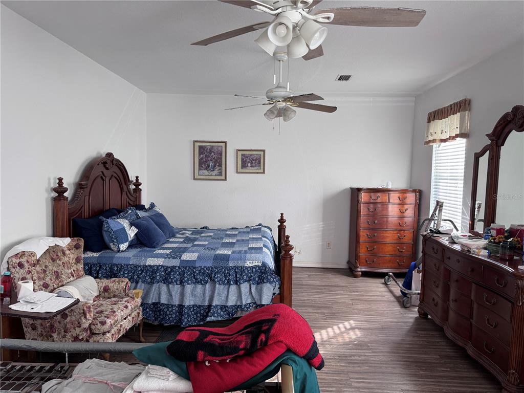 119 Hawthorne Road Auburndale, FL 33823 - Photo 14 of 26 a bedroom with furniture and wooden floor
