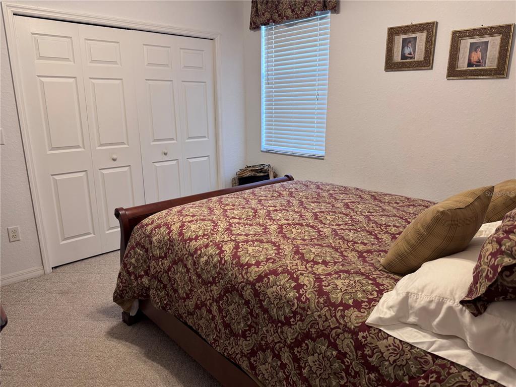 119 Hawthorne Road Auburndale, FL 33823 - Photo 19 of 26 a bedroom with a bed and a window