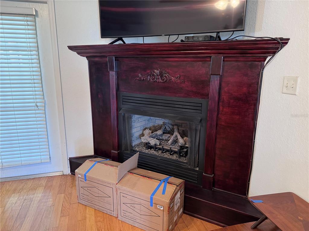 119 Hawthorne Road Auburndale, FL 33823 - Photo 6 of 26 a living room with furniture and a fireplace