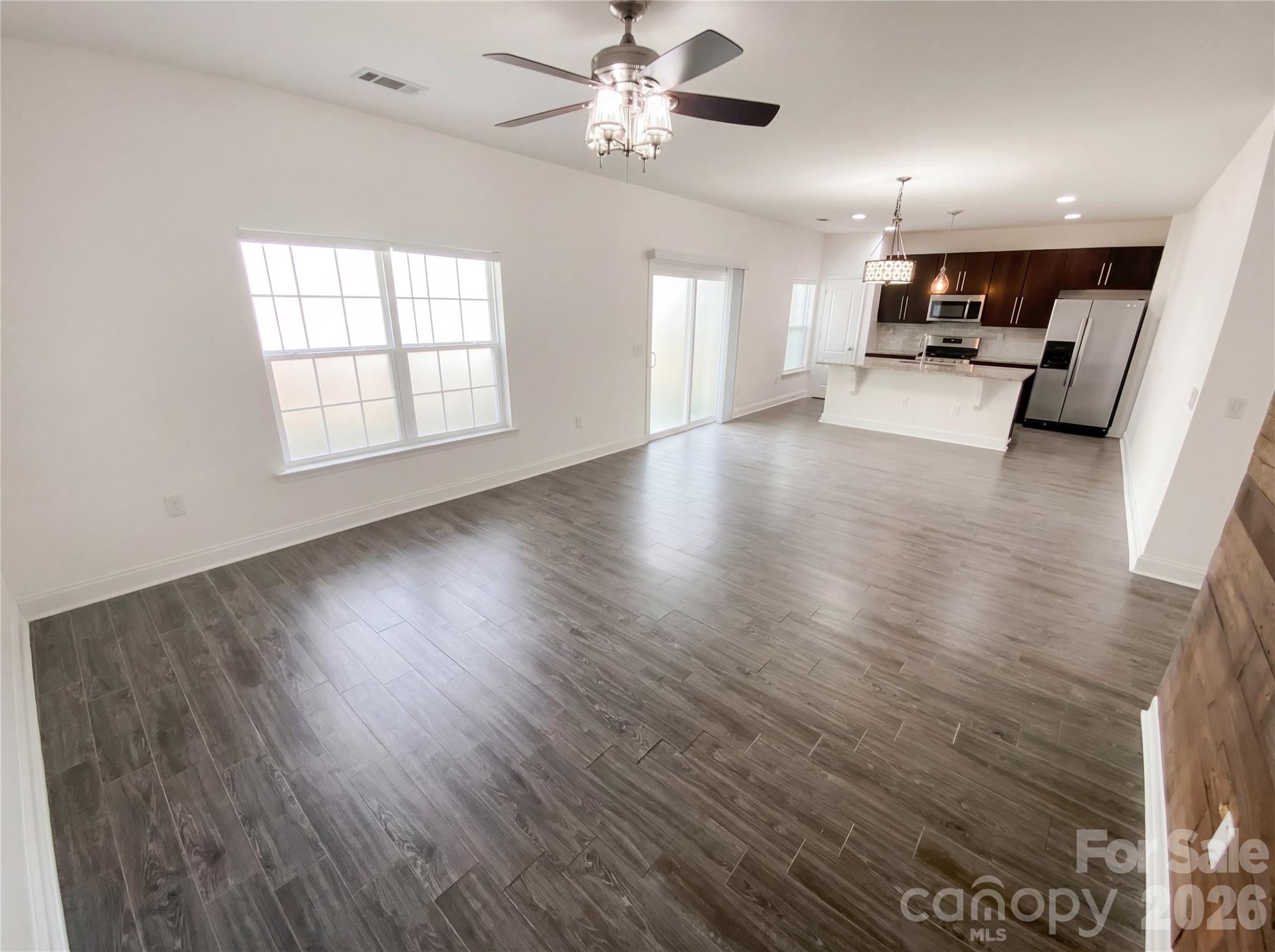 211 Waterlemon Way Monroe, NC 28110 - Photo 11 of 16 a view of a kitchen with a sink and a stove top oven