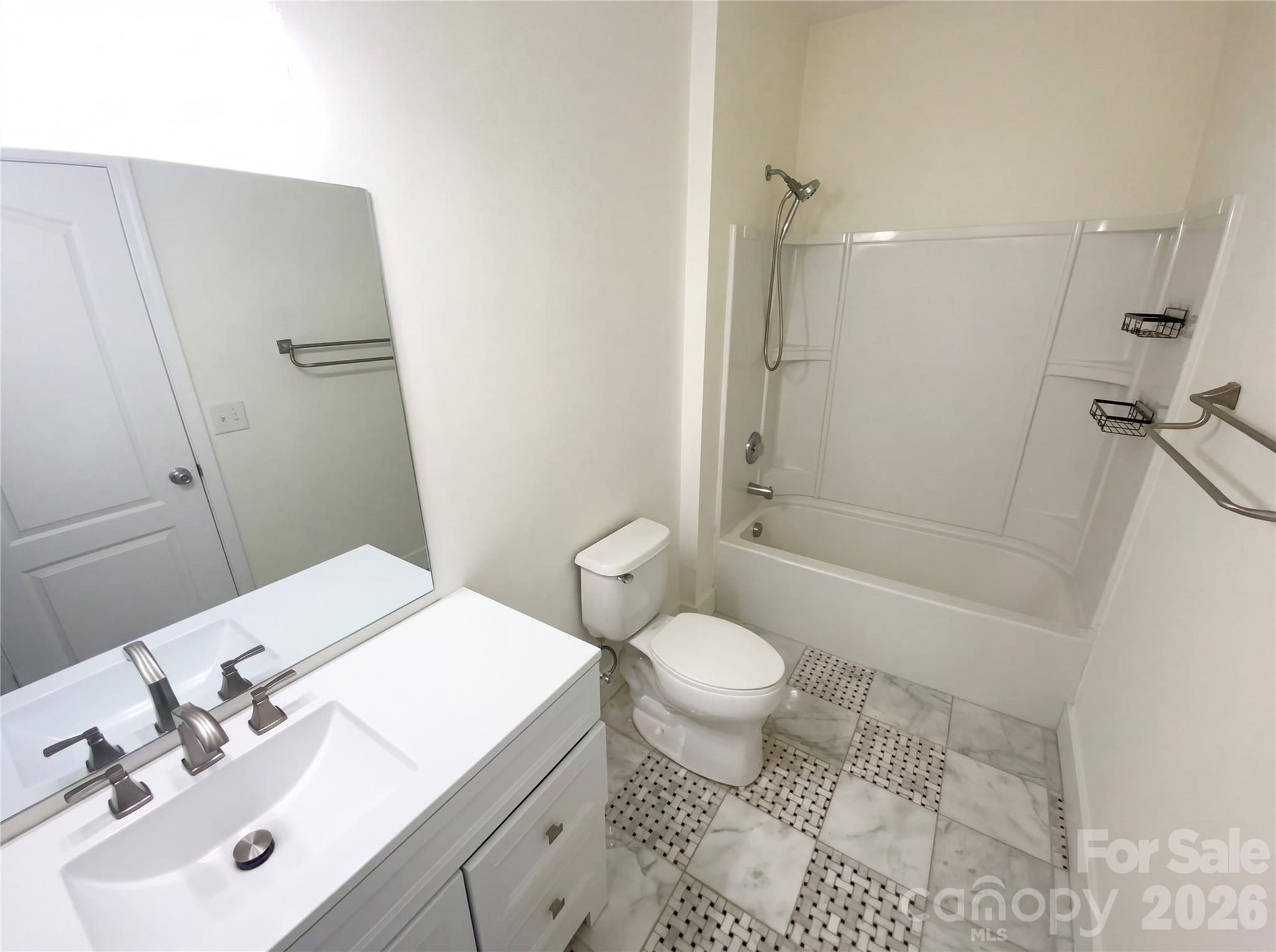 211 Waterlemon Way Monroe, NC 28110 - Photo 15 of 16 a bathroom with a sink toilet a mirror and shower