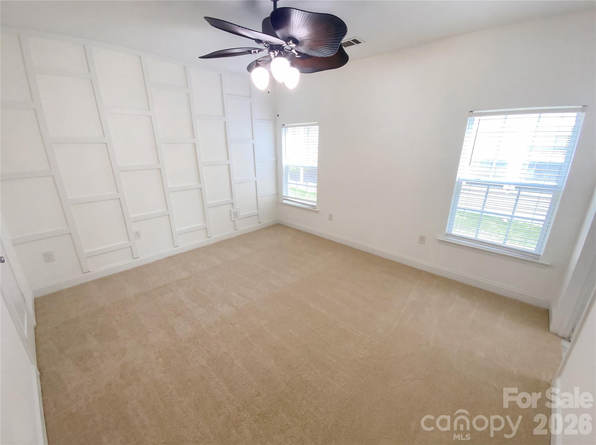 211 Waterlemon Way Monroe, NC 28110 - Photo 4 of 16 an empty room with windows and fan