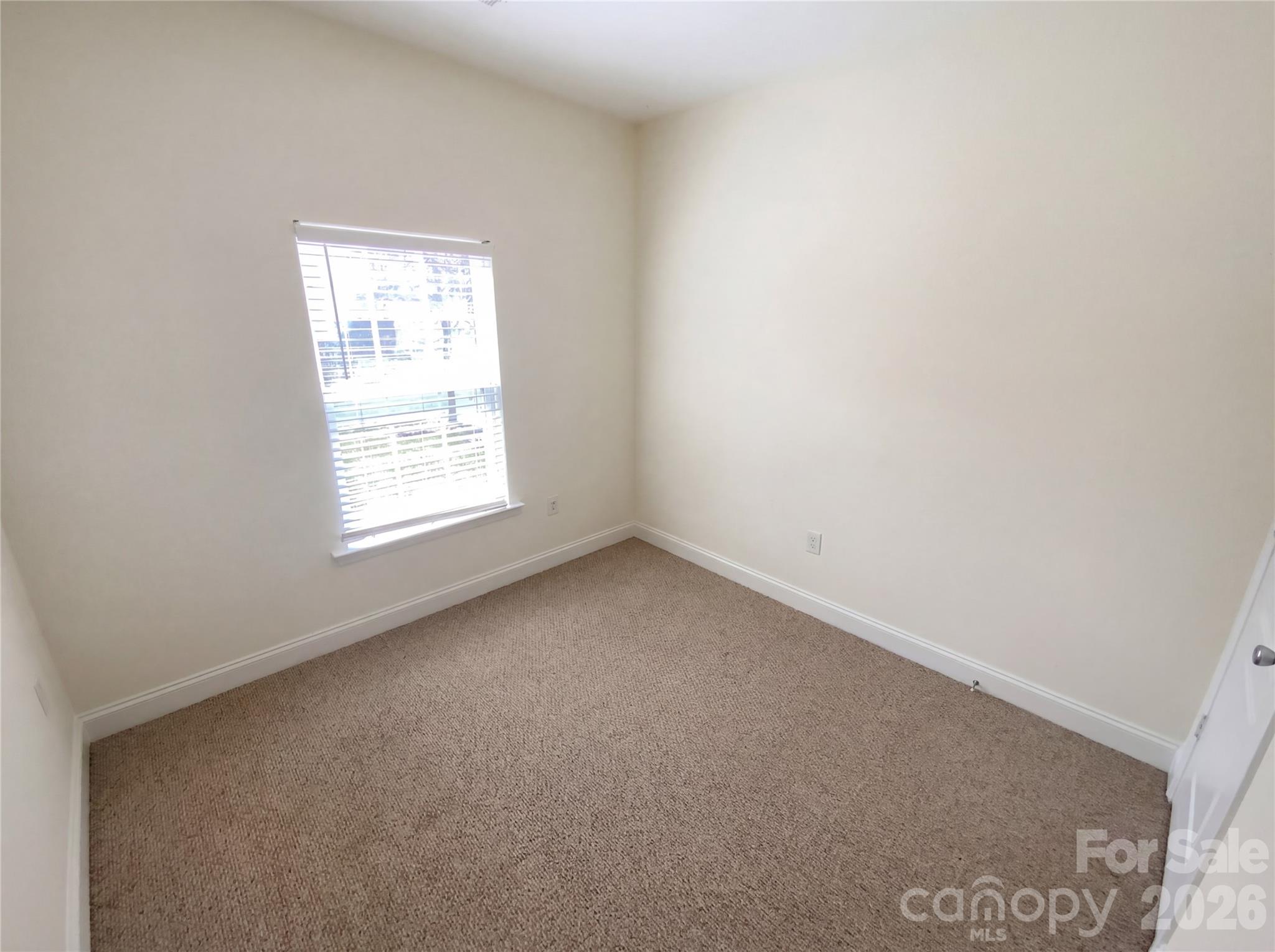 211 Waterlemon Way Monroe, NC 28110 - Photo 6 of 16 an empty room with a window