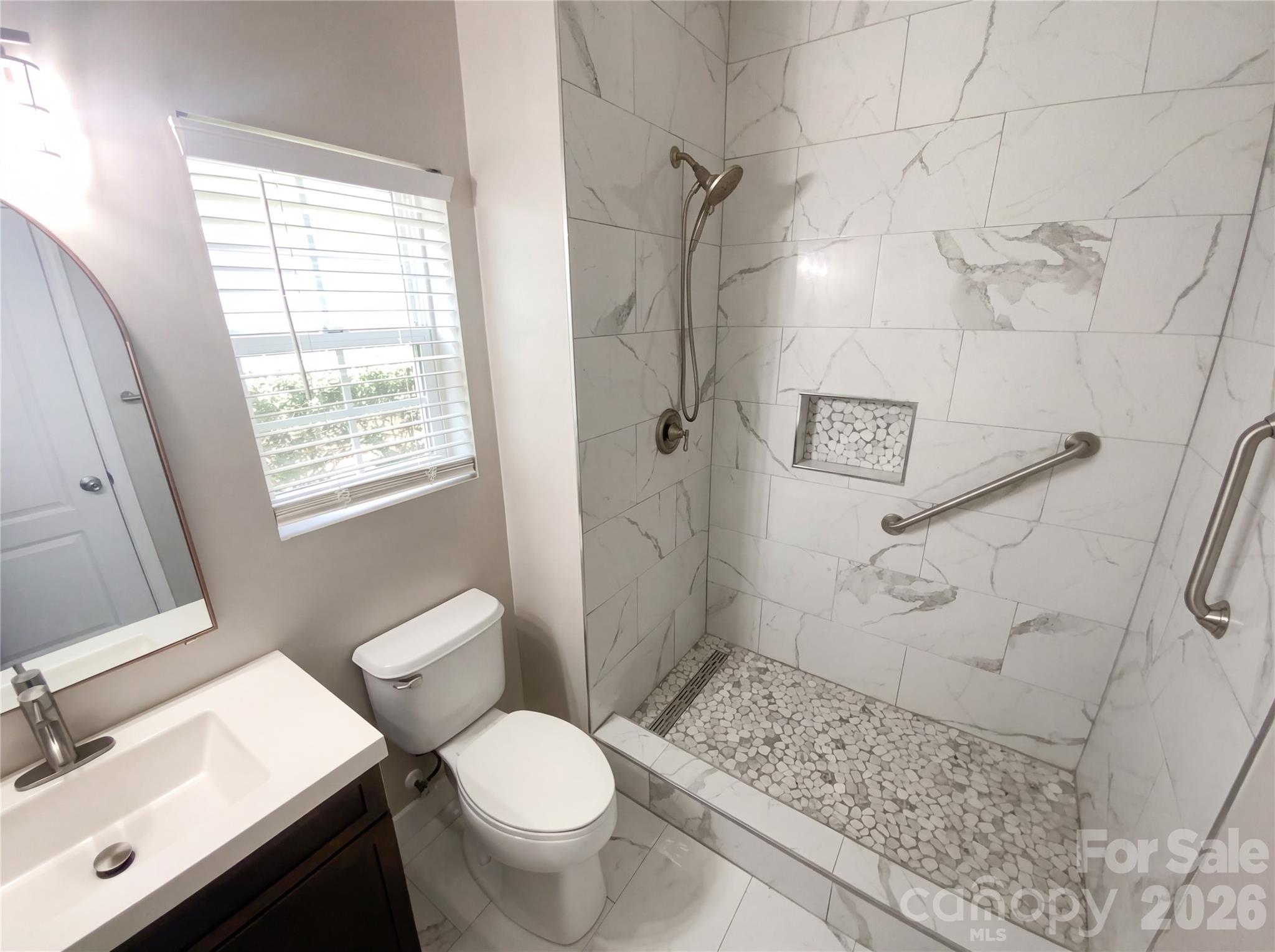 211 Waterlemon Way Monroe, NC 28110 - Photo 7 of 16 a bathroom with a sink toilet and shower