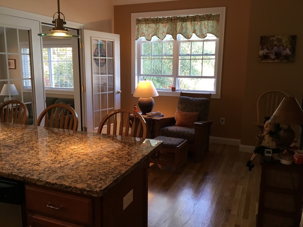 4 D Charles Ridge Road, Unit D Littleton, MA 01460 - Photo 8 of 23 a kitchen with sink refrigerator and window