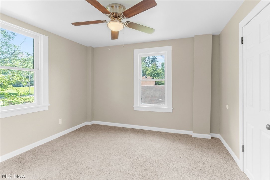4646 Kirk Road Youngstown, OH 44515 - Photo 15 of 18 Carpeted spare room with ceiling fan