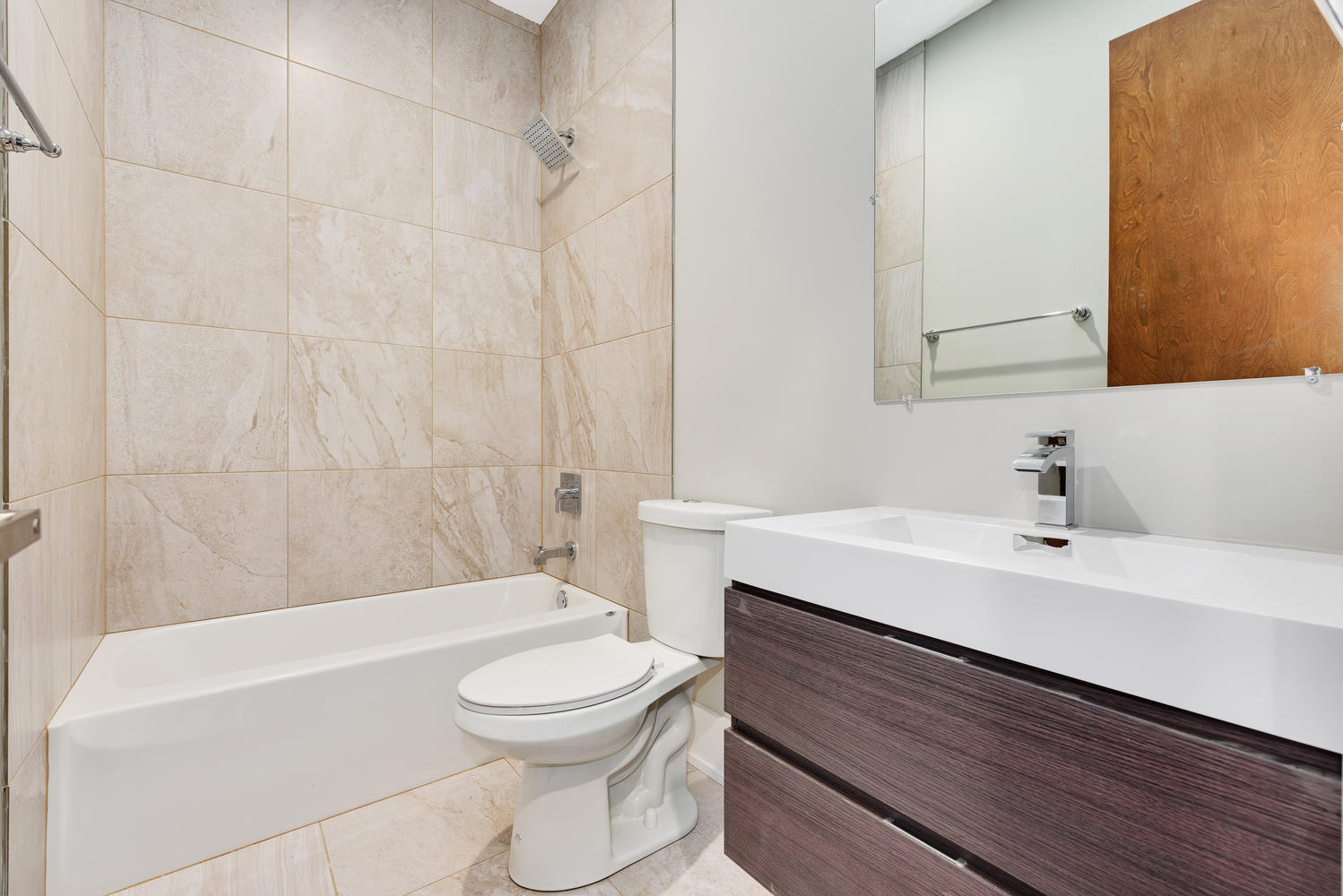 2518 West Division Street, Unit NE Chicago, IL 60622 - Photo 12 of 13 a bathroom with a sink a toilet and shower