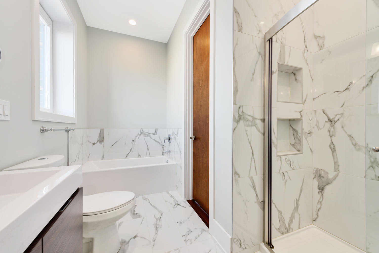 2518 West Division Street, Unit NE Chicago, IL 60622 - Photo 10 of 13 a bathroom with a sink toilet and shower