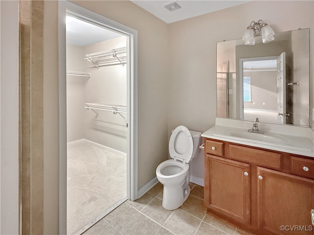 2324 Millcrest Terrace Midlothian, VA 23112 - Photo 18 of 25 a spacious bathroom with a granite countertop toilet a sink and a mirror