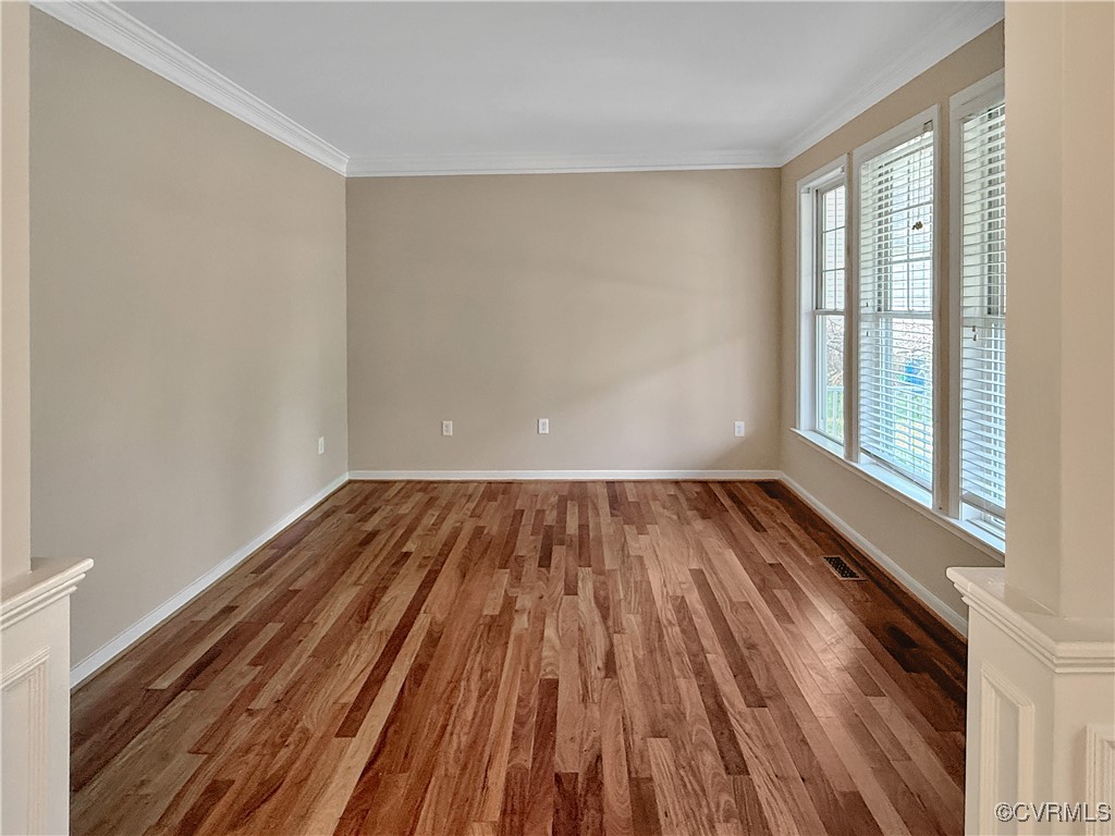 2324 Millcrest Terrace Midlothian, VA 23112 - Photo 3 of 25 an empty room with wooden floor and windows