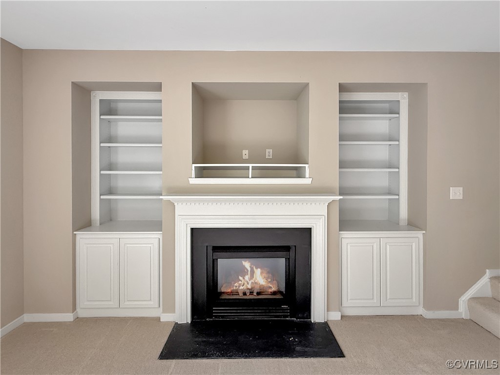 2324 Millcrest Terrace Midlothian, VA 23112 - Photo 9 of 25 a living room with a fireplace cabinet and a window