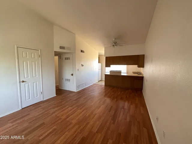 a kitchen with a stove sink and cabinets