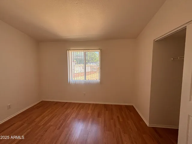 a view of a patio with chairs and plants