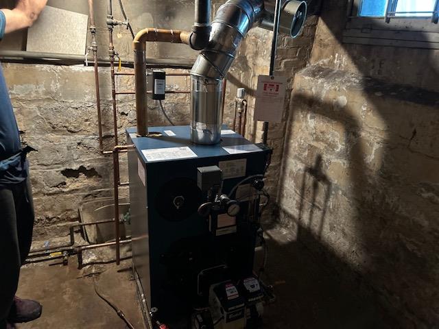 62-53 80th Road Queens, NY 11385 - Photo 11 of 11 Utilities with a heating unit