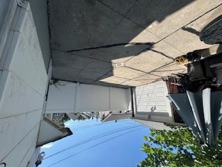 62-53 80th Road Queens, NY 11385 - Photo 4 of 11 View of patio / terrace with a garage and an outdoor structure