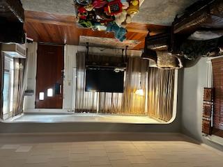 62-53 80th Road Queens, NY 11385 - Photo 5 of 11 Living room featuring wood finished floors