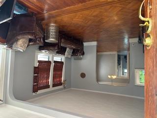 62-53 80th Road Queens, NY 11385 - Photo 7 of 11 Living room with arched walkways, healthy amount of natural light, and ornamental molding