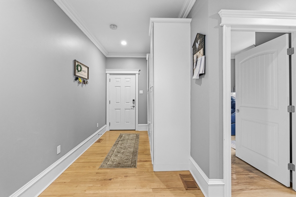 35 High Street Freetown, MA 02702 - Photo 28 of 40 a view of a hallway with closet and wooden floor