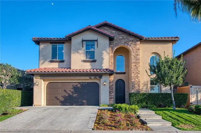 a front view of a house with garden