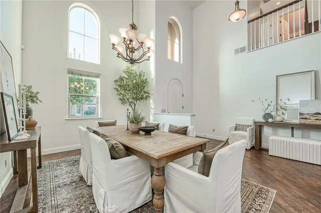 a living room with furniture a fireplace and a table