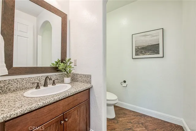 a living room with furniture and two large window
