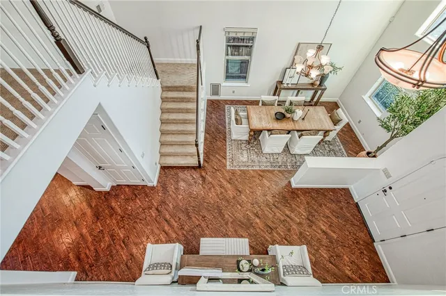 a bathroom with a granite countertop sink a toilet a mirror and bathtub
