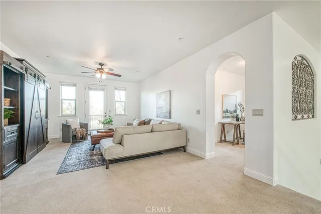 an empty room with closet and a window