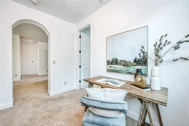 a en suite bathroom with a granite countertop sink and a mirror