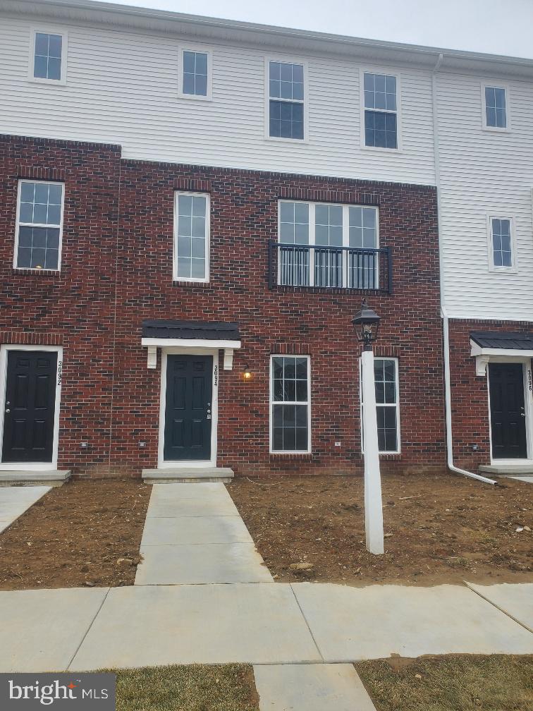 a front view of a house with yard