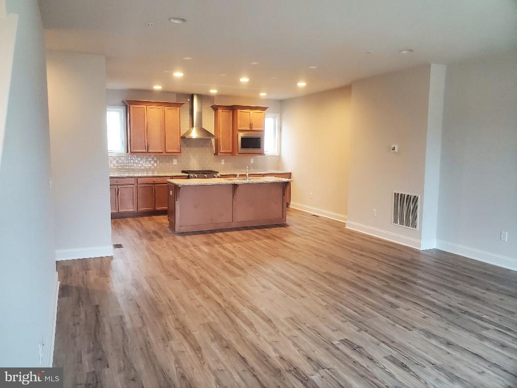 3094 Egreton Road Mechanicsburg, PA 17055 - Photo 3 of 14 a large kitchen with stainless steel appliances granite countertop a dishwasher and a wooden floors