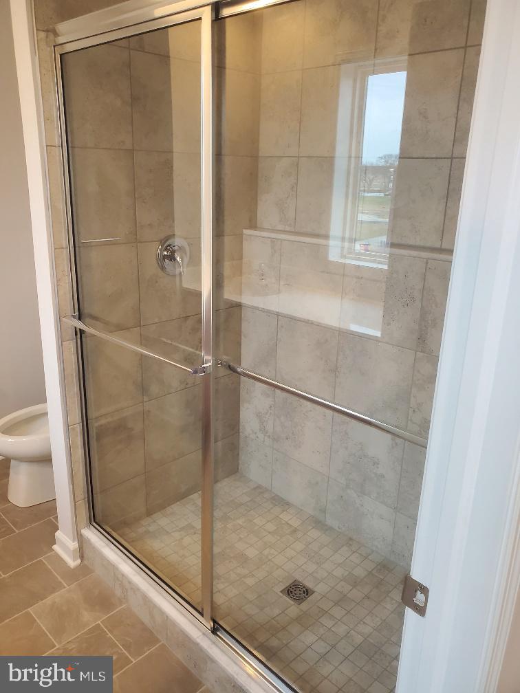 3094 Egreton Road Mechanicsburg, PA 17055 - Photo 8 of 14 a bathroom with a glass shower door