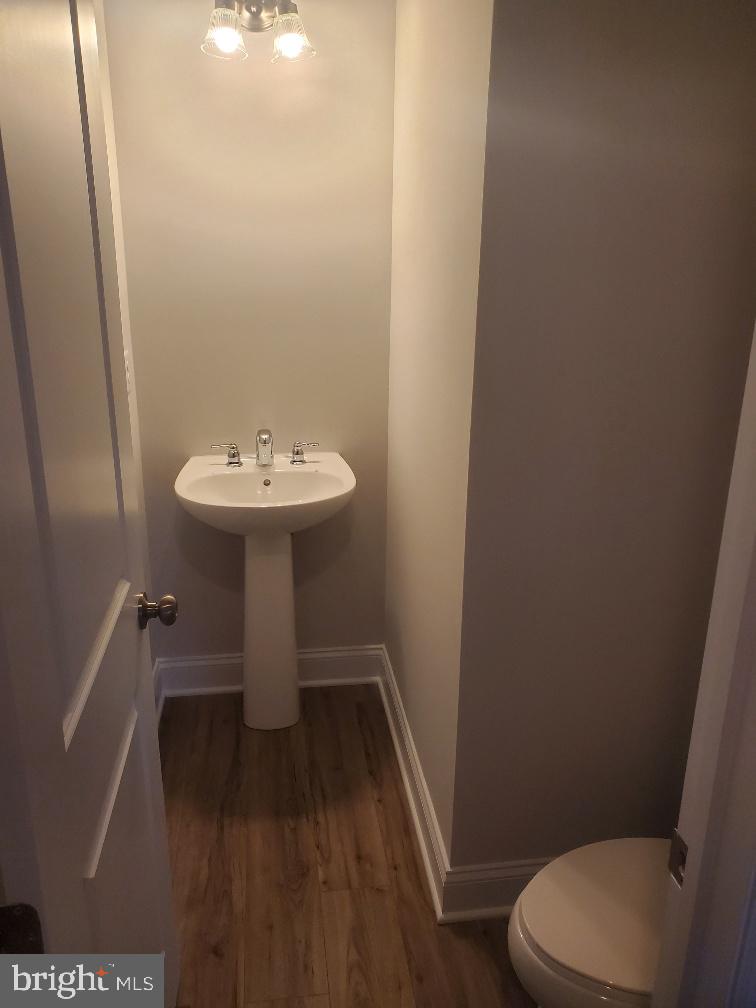 3094 Egreton Road Mechanicsburg, PA 17055 - Photo 10 of 14 a bathroom with a sink a toilet and a mirror