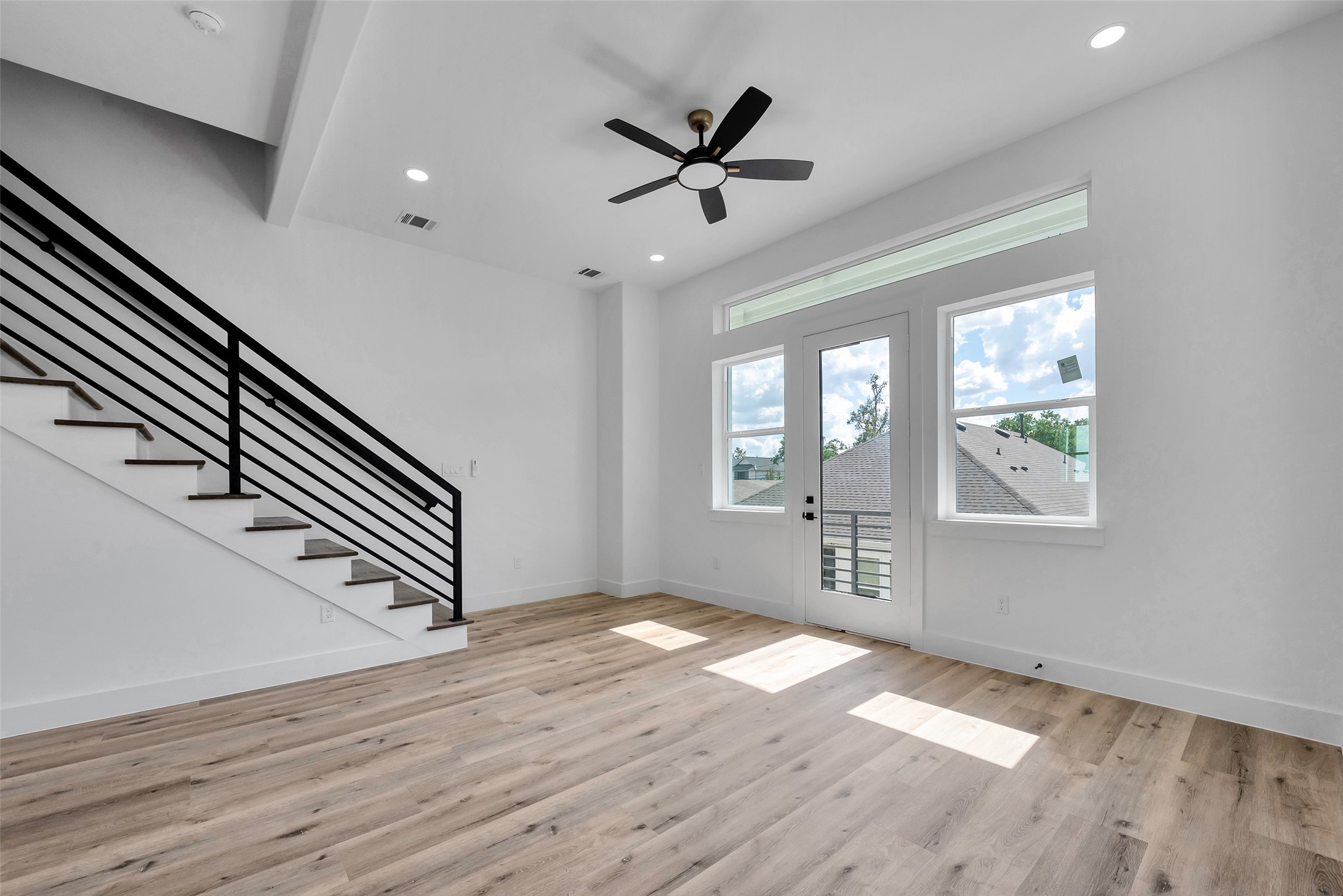 1805 Emir Street, Unit H Houston, TX 77009 - Photo 15 of 43 wooden floor in an empty room with a window