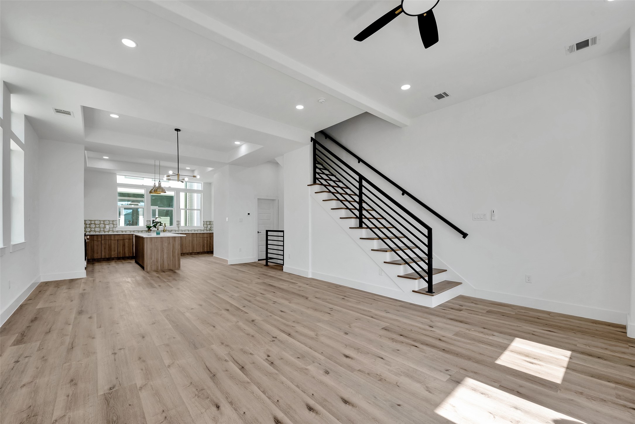 1805 Emir Street, Unit H Houston, TX 77009 - Photo 22 of 43 an empty room with kitchen ceiling fan and windows