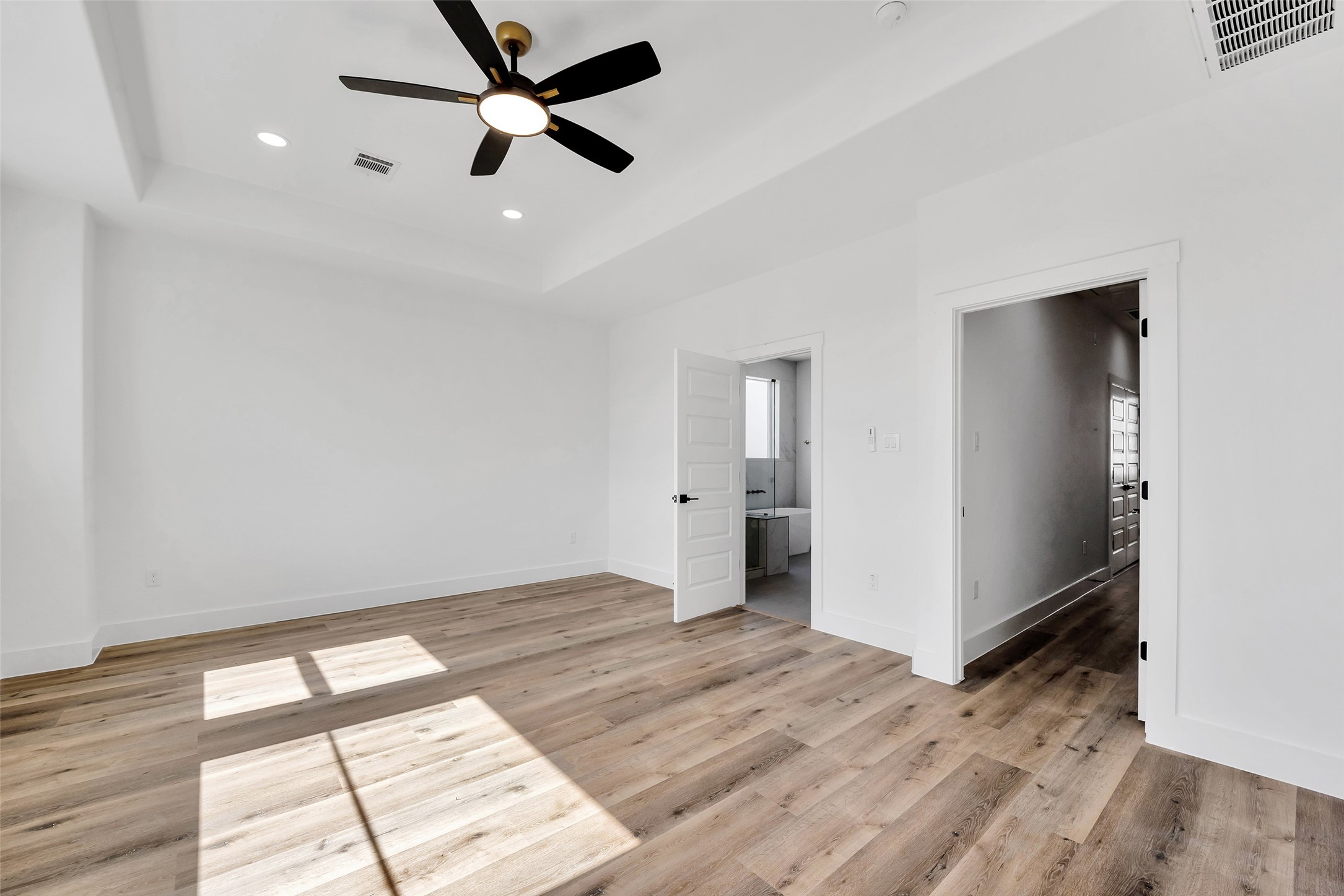 1805 Emir Street, Unit H Houston, TX 77009 - Photo 26 of 43 wooden floor in an empty room with a window