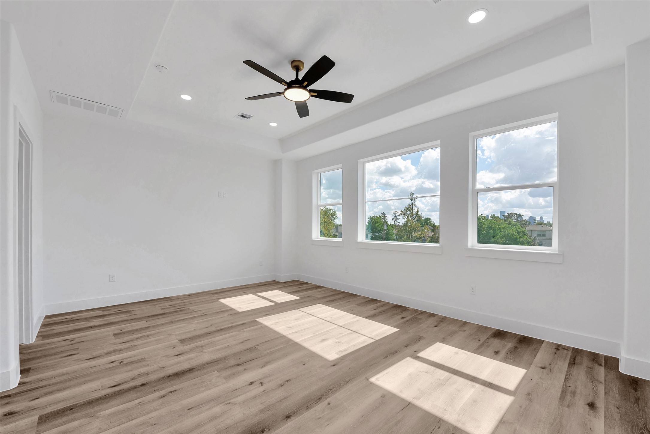 1805 Emir Street, Unit H Houston, TX 77009 - Photo 27 of 43 a view of empty room with wooden floor and fan