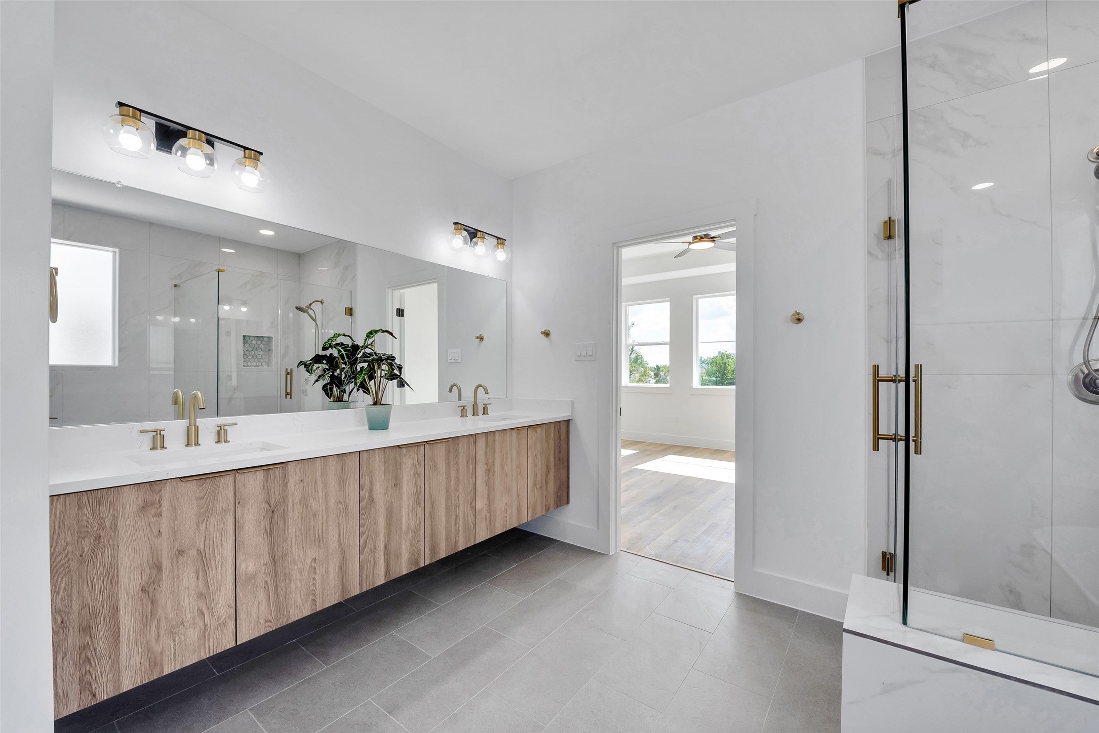 1805 Emir Street, Unit H Houston, TX 77009 - Photo 4 of 43 a bathroom with a double vanity sink and mirror