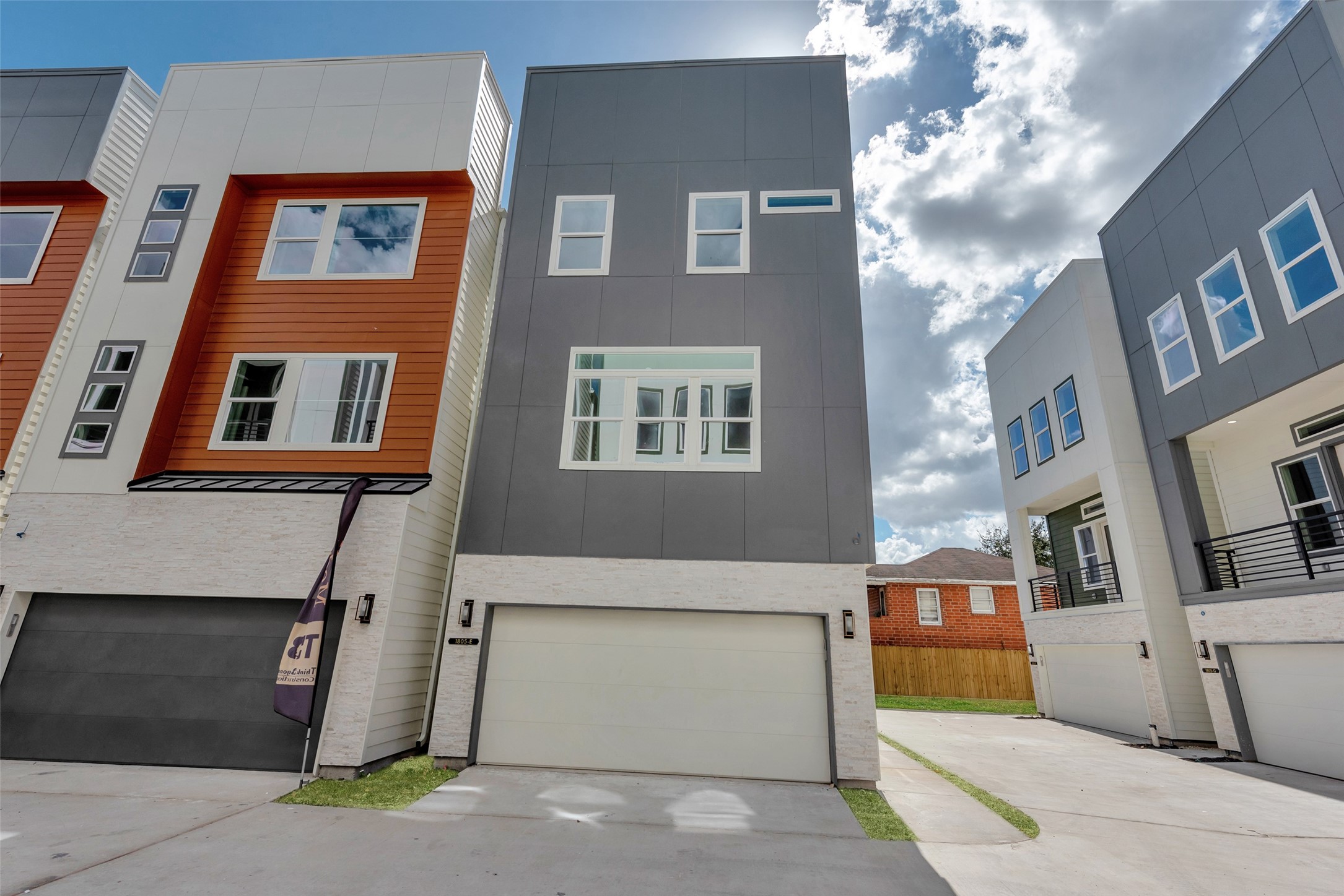 1805 Emir Street, Unit H Houston, TX 77009 - Photo 5 of 43 a front view of a building with many windows