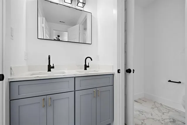a view of a livingroom with a ceiling fan and window