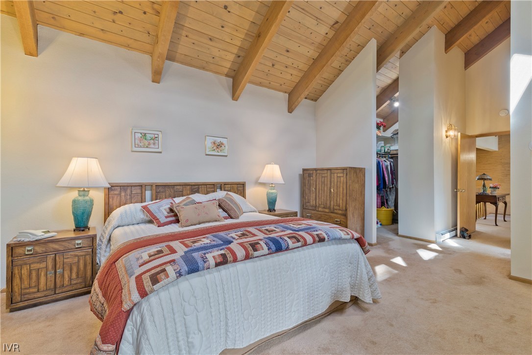 607 Crystal Peak Road Incline Village, NV 89451 - Photo 14 of 34 a bedroom with a bed and a lamp on the dresser
