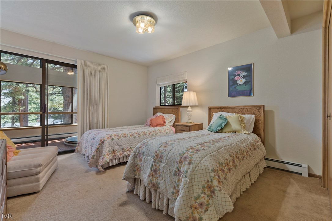 607 Crystal Peak Road Incline Village, NV 89451 - Photo 22 of 34 a bedroom with a bed and a large window