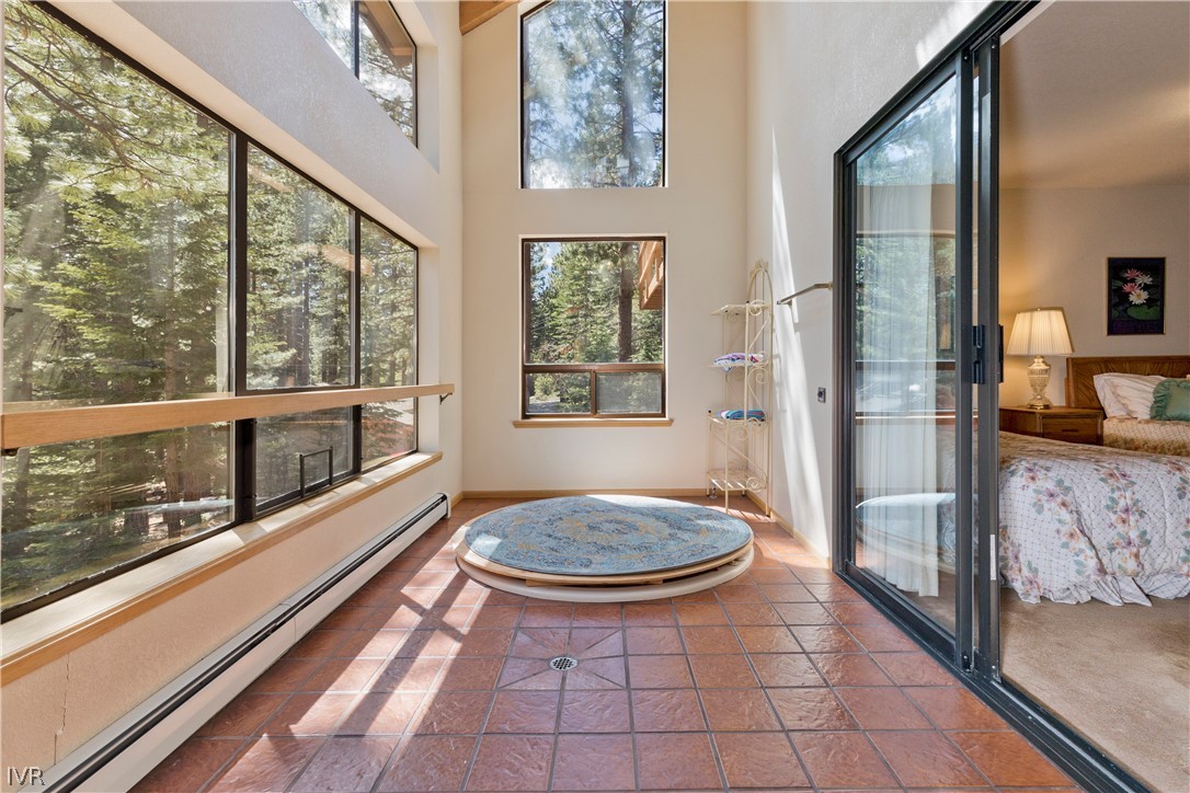607 Crystal Peak Road Incline Village, NV 89451 - Photo 28 of 34 a bathroom with a tub a sink and a large window