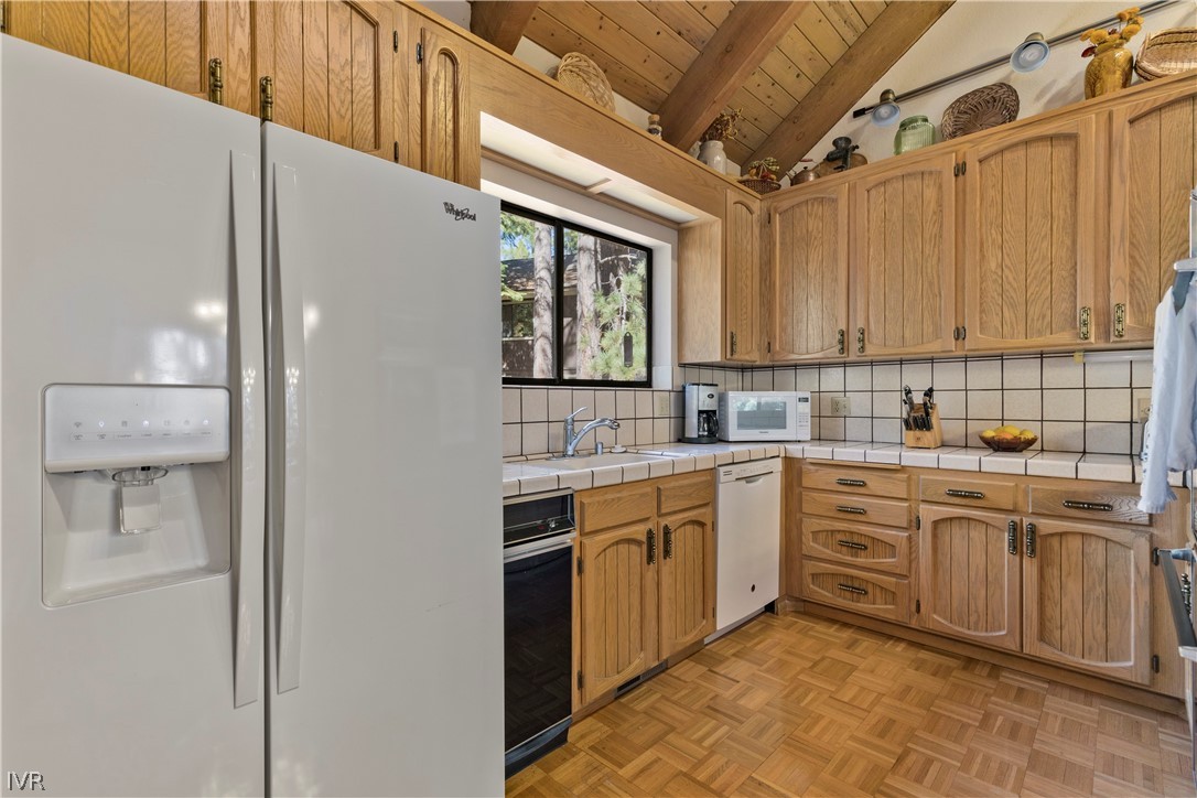 607 Crystal Peak Road Incline Village, NV 89451 - Photo 6 of 34 a kitchen that has a sink and cabinets
