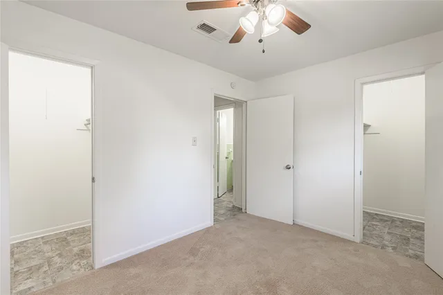 an empty room with a bathroom