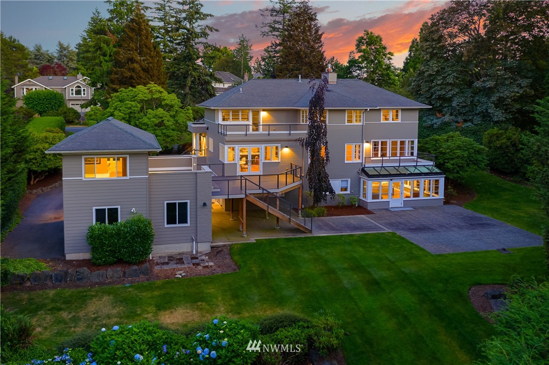 245 Middlefield Road Bellingham, WA 98225 - Photo 1 of 40 a aerial view of a house with table and chairs under an umbrella